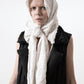 DZHUS Extract as a vest with a scarf worn on a head