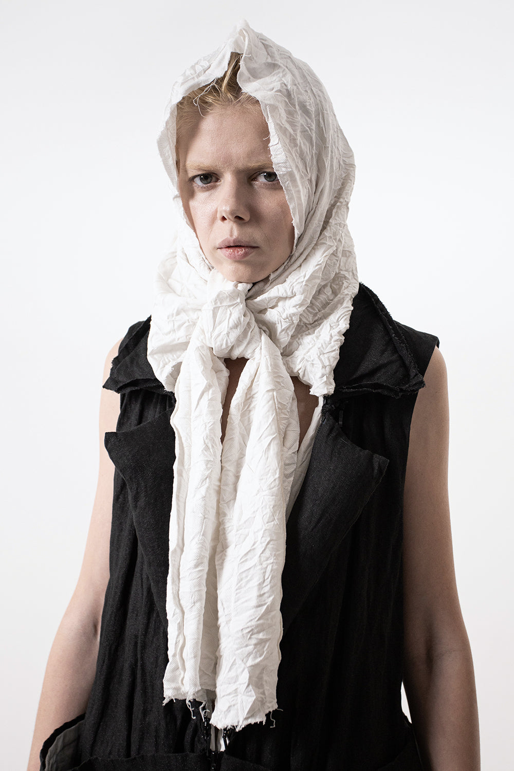 DZHUS Extract as a vest with a scarf worn on a head