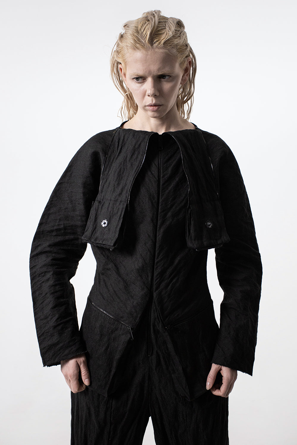 DZHUS Irony as a jumpsuit with a geometrical collar